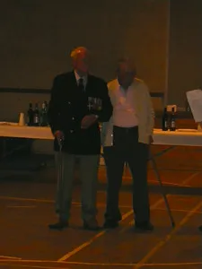Two people receiving an award at the Le Chemin gathering
