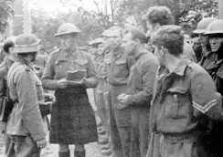 Captured British soldiers guarded after surrendering on 12 June 1940