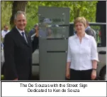 The de Souzas with the street sign dedicated to Ken de Souza