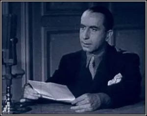 Radio Londres broadcaster Franck Bauer at a microphone