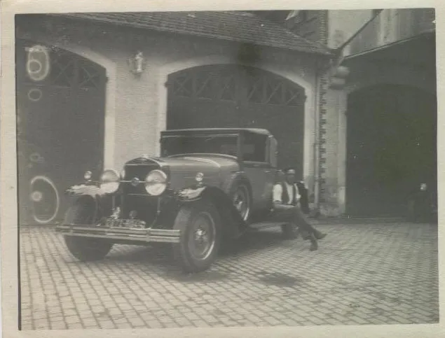 Albert Johnson beside a car in Brussels