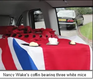 Nancy Wake's coffin bearing three white mice