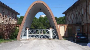 The present-day main gate at PG 70