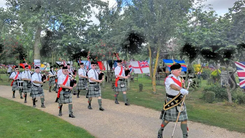 The Sheffield Pipe Band marching through the Arboretum