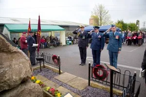 Service personnel saluting during the ELMS remembrance service