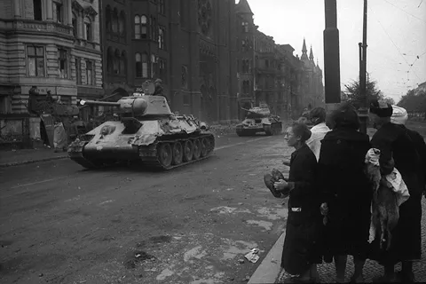 Soviet troops entering a European town