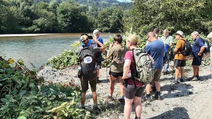 ELMS walkers gathered beside the river crossing on the Crow’s Flight Trail