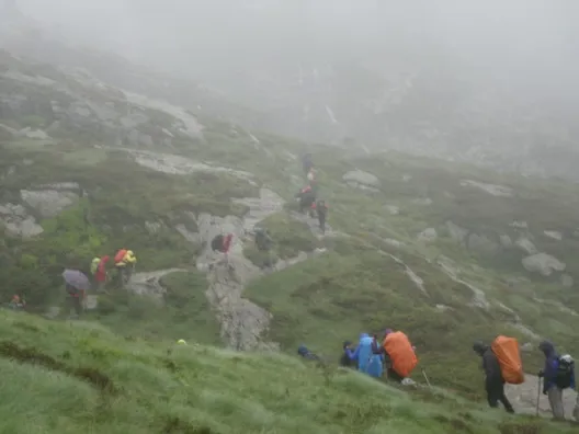Walkers following the Chemin route in mist